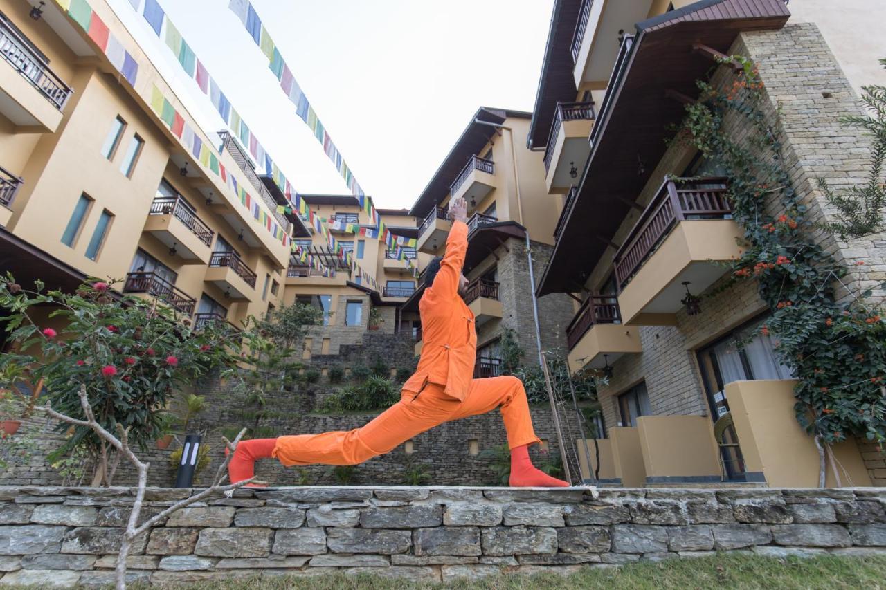 Bar Peepal Resort Pókhara Exteriér fotografie A student of the Drepung Loseling Nunnery, practicing yoga.